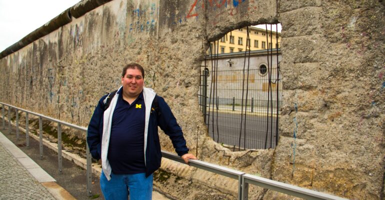 Me in front of the Berlin Wall