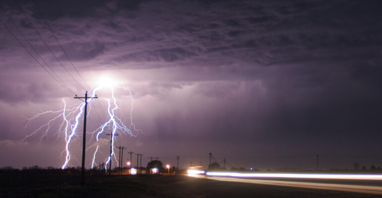 Lightning next to the highway